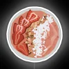 pink-smoothie-bowl-with-neon-sign-on-white-background
