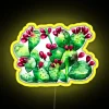 A colorful RGB neon sign displaying a prickly pear cactus in vibrant yellow.