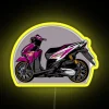 Neon purple and yellow motorcycle sign with RGB glow.