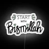 Image of a Quranic quote starting with Bismillah, presented as a vibrant neon sign in RGB colors with white highlights.