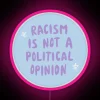 Racism is not a political opinion neon sign with vibrant RGB and pink tones, promoting diversity and equality.