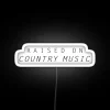 RGB Neon Sign Saying Raised On Country Music
