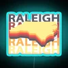 vintage rgb neon sign promoting souvenirs from raleigh nc, eye-catching raleigh nc souvenir shop signage