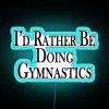 Rather Be Doing Gymnastics neon sign in vibrant RGB blue.