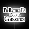 Rather Be Doing Gymnastics neon sign with vibrant RGB glow.