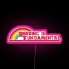 Neon sign displaying 'Reading Is Fundamental' in RGB colors with a pink tint.