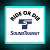 alt="rgb-colored ride-or-die neon transit sign