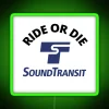 A vibrant RGB neon sign displaying 'Ride or Die' with a Sound Transit design.