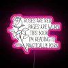 RGB neon sign displaying 'The Book I'm Reading is Practically Porn' in vibrant pink.