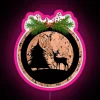 alt text: rustic christmas forest deer silhouette rgb neon pink sign