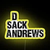 neon-sign-displaying-dan-andrews-in-rgb-yellow