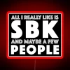 A vibrant SBK Latin dancer neon sign with RGB LED lighting in red.