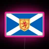 Scottish flags on phone cases and masks with LED lights, featuring an RGB neon sign in pink.