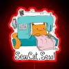 A colorful neon sign displaying 'Sew Cat Sew' in RGB colors with a focus on red.
