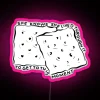 RGB neon sign displaying "She Knows She Lived Through It To Get To This Moment" in pink design