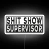 RGB neon sign displaying 'Shit Show Supervisor' in white.
