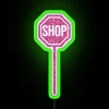Neon shop sign with pink glitter design and RGB colors, eye-catching display.