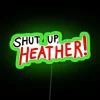 RGB neon sign displaying 'Shut Up Heather' in vibrant green lights.