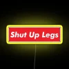 RGB neon cycling sign featuring a red and yellow box with 'shut up legs' text.