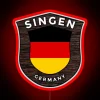 Neon sign displaying German flag and emblem in vibrant RGB colors at Singen, Germany.