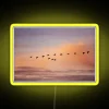 Neon Flight Sign with Yellow Lights against Dark Background