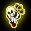 RGB neon sign featuring a cartoon skeleton playing bass guitar in yellow glow.