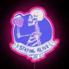 RGB Neon Sign of a Skeleton Drinking Coffee with Pink Accents, Motivational Quote About Persevering Through Daily Life Cha...