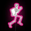 Neon pink sign featuring a graphic skeleton in front of an anatomy chart, highlighting orthopedic nursing and physical the...