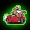 Neon sign of a green skeleton riding a motorcycle with sidecar.