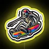 Neon RGB sign featuring a skeleton on a skateboard in a vibrant yellow color.
