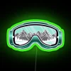 Ski goggles with neon green accents on a colorful background