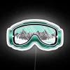 Close-up of brightly colored ski goggles with neon RGB accents, lying on a white background.