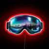 Winter sports gear with colorful ski goggles, reflecting Northern Lights on a mountain landscape