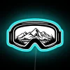 Close-up of neon-lit ski goggles in an artistic design, blending travel and sports elements.