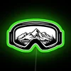 Neon-colored ski goggles on a travel-themed design backdrop.