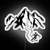 Skiing neon sign against a dark background with black and white ski lines