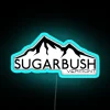 Vibrant skiing and snowboarding adventure in the snowy mountains of Warren Vermont, highlighted by a stunning neon sign at...