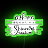 Neon skincare routine sign with green glowing letters on a dark background.
