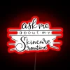 Neon sign reading "Skincare Routine" in bold, colorful letters.