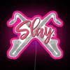 Neon-lit musical instrument sign featuring a bass clarinet in bold, colorful graphics.