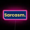 Witty fashionista posing in front of a neon sign with bold, pink lettering reading 'Slay with Sarcasm.'