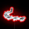 Sledding dogs illuminated by vibrant neon lights.