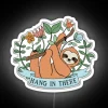 Hanging neon sign with colorful sloth illustration