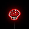 Red neon mushroom street sign in urban landscape