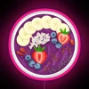 Vibrant purple smoothie bowl with acai, fresh fruit, and neon accents.