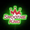 Neon Smoothie King cafe sign with bright green color and RGB lighting effects.