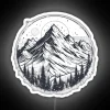 Neon sign reflecting off snow-capped mountains at night.