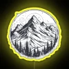 Neon sign reflecting off snow-covered mountain peaks at night.