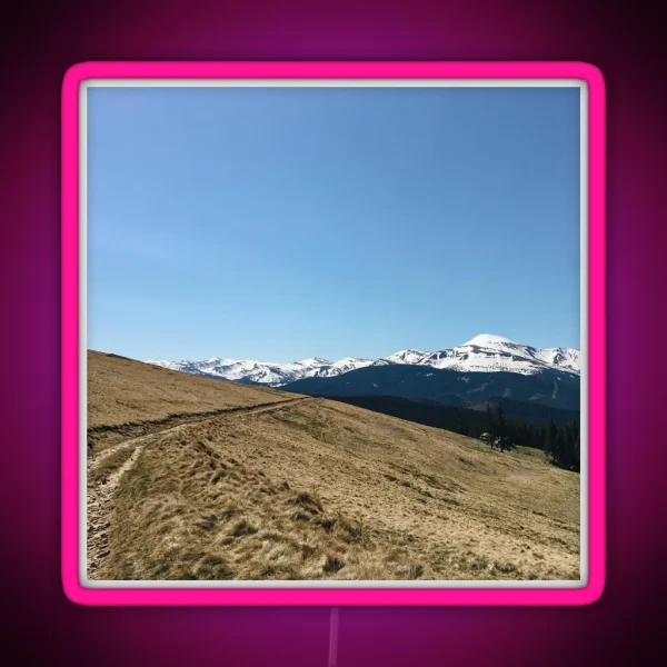 Snowy Mountain Peaks And Forest Landscape On The RGB Neon Sign