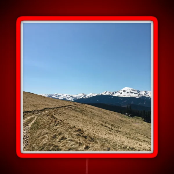 Snowy Mountain Peaks And Forest Landscape On The RGB Neon Sign
